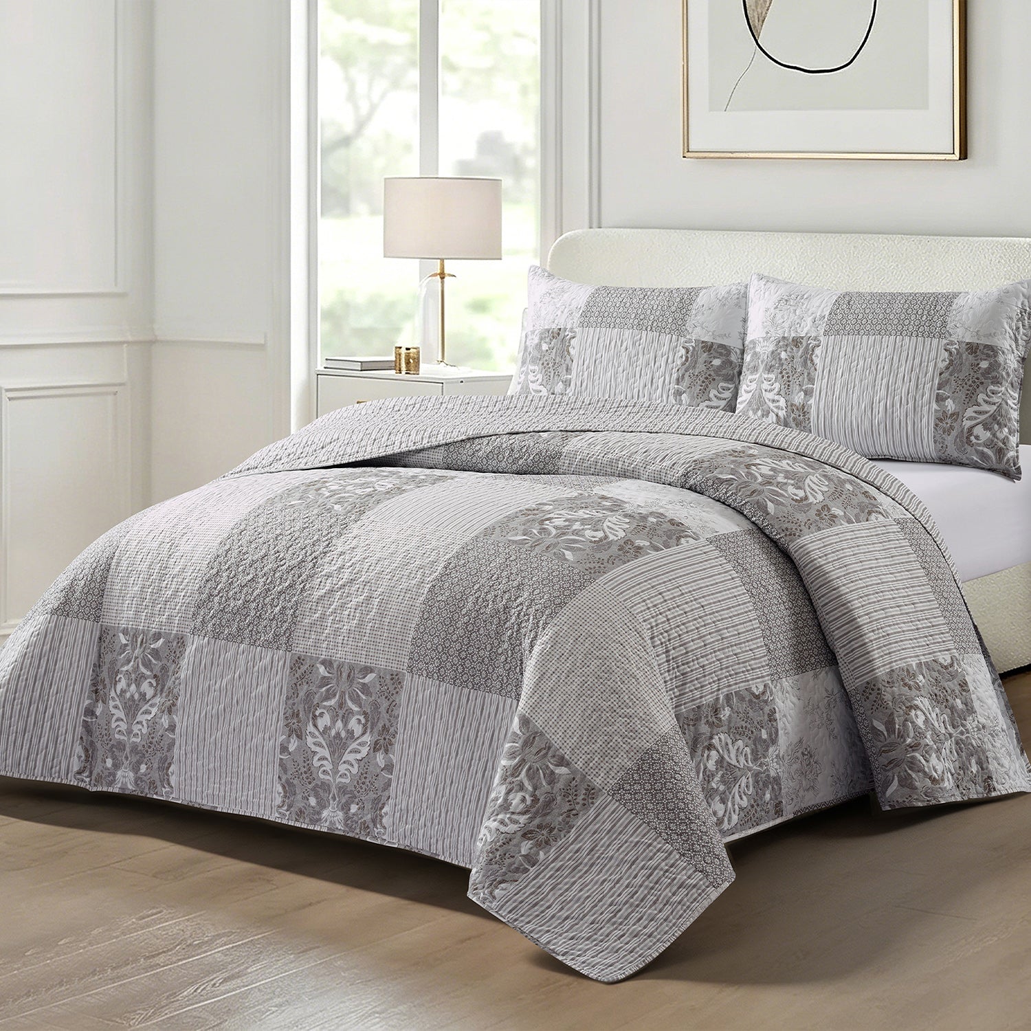 Home Co. Tara Patchwork Coverlet Set in Grey Beige, styled on a bed with coordinating patchwork pillow shams in a bright neutral bedroom.