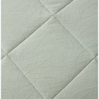 Light Green quilted coverlet close-up showing soft textured fabric and stitched detail
