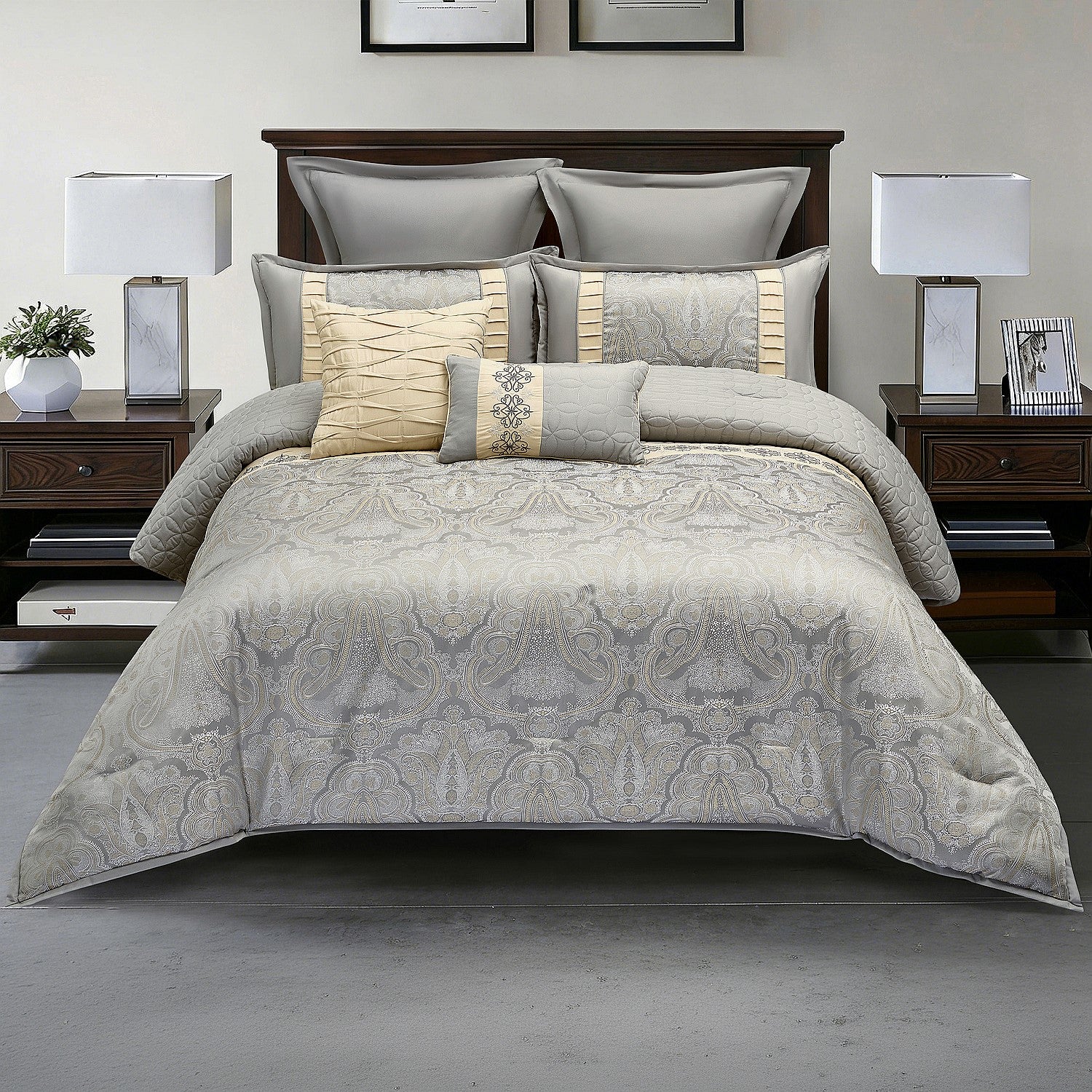 Grey patterned comforter set styled on a bed with matching pillows in a modern bedroom.