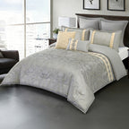 Grey patterned comforter set styled on a bed with matching pillows in a modern bedroom.