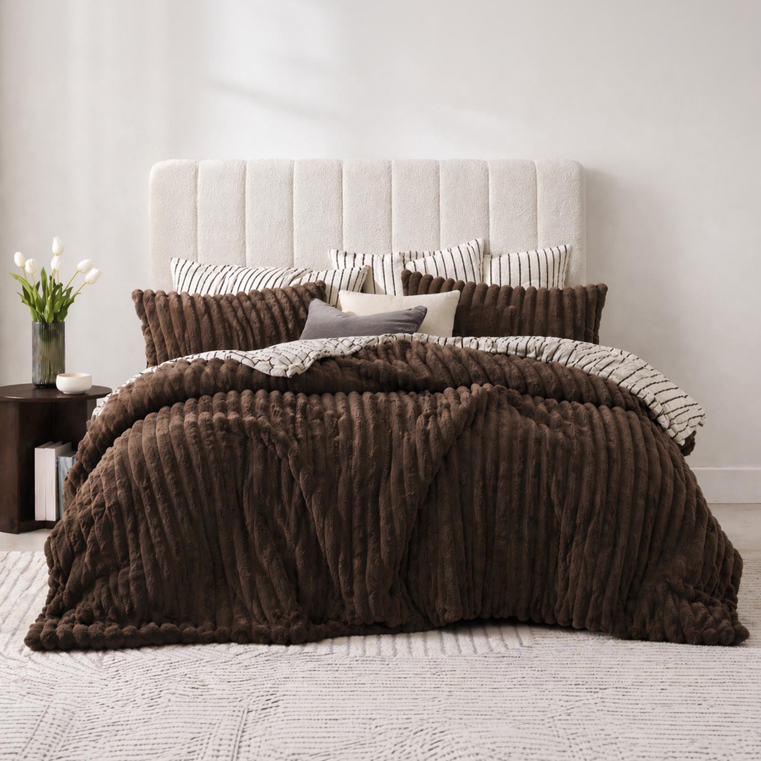 Chocolate ribbed comforter set styled on a bed with matching pillows in a neutral bedroom.