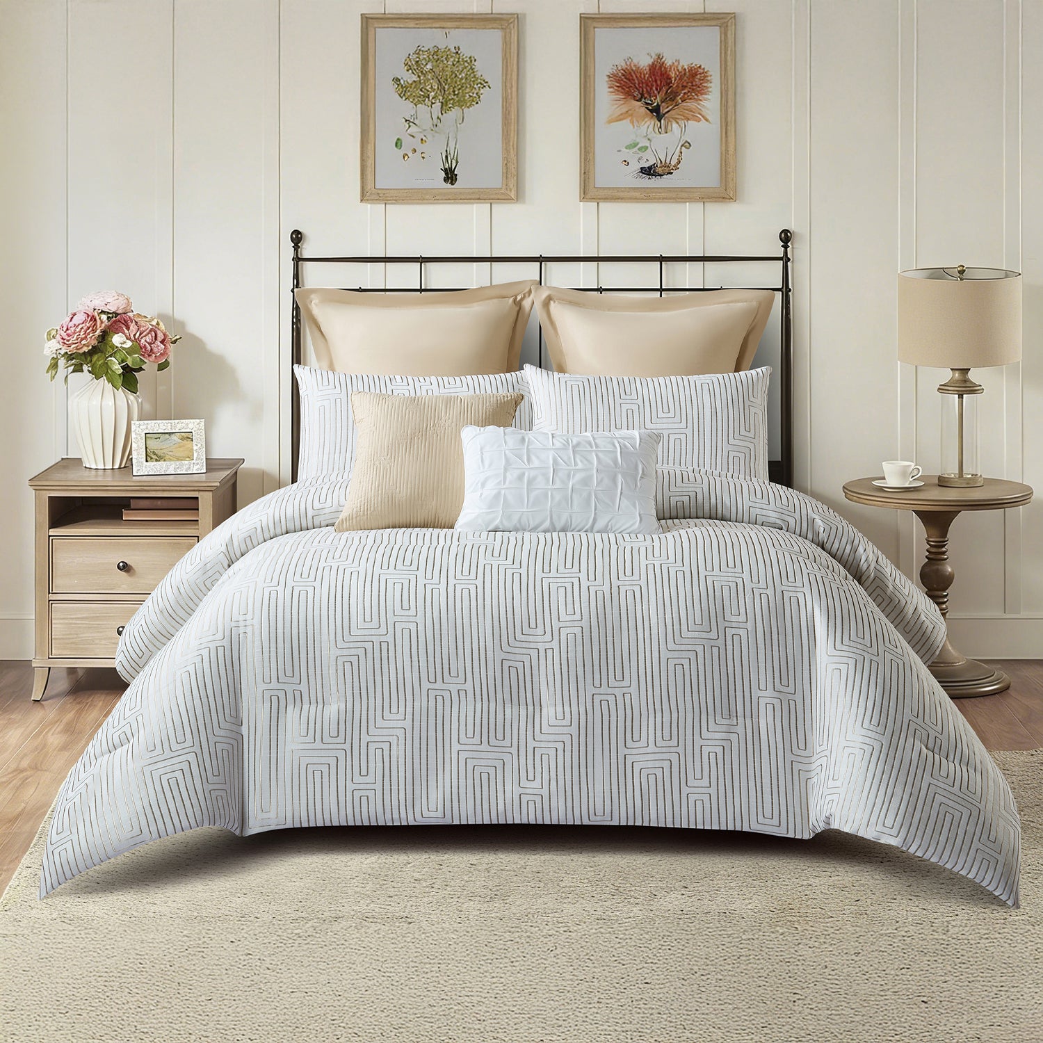 White textured comforter set styled on a bed with matching pillows in a neutral bedroom.