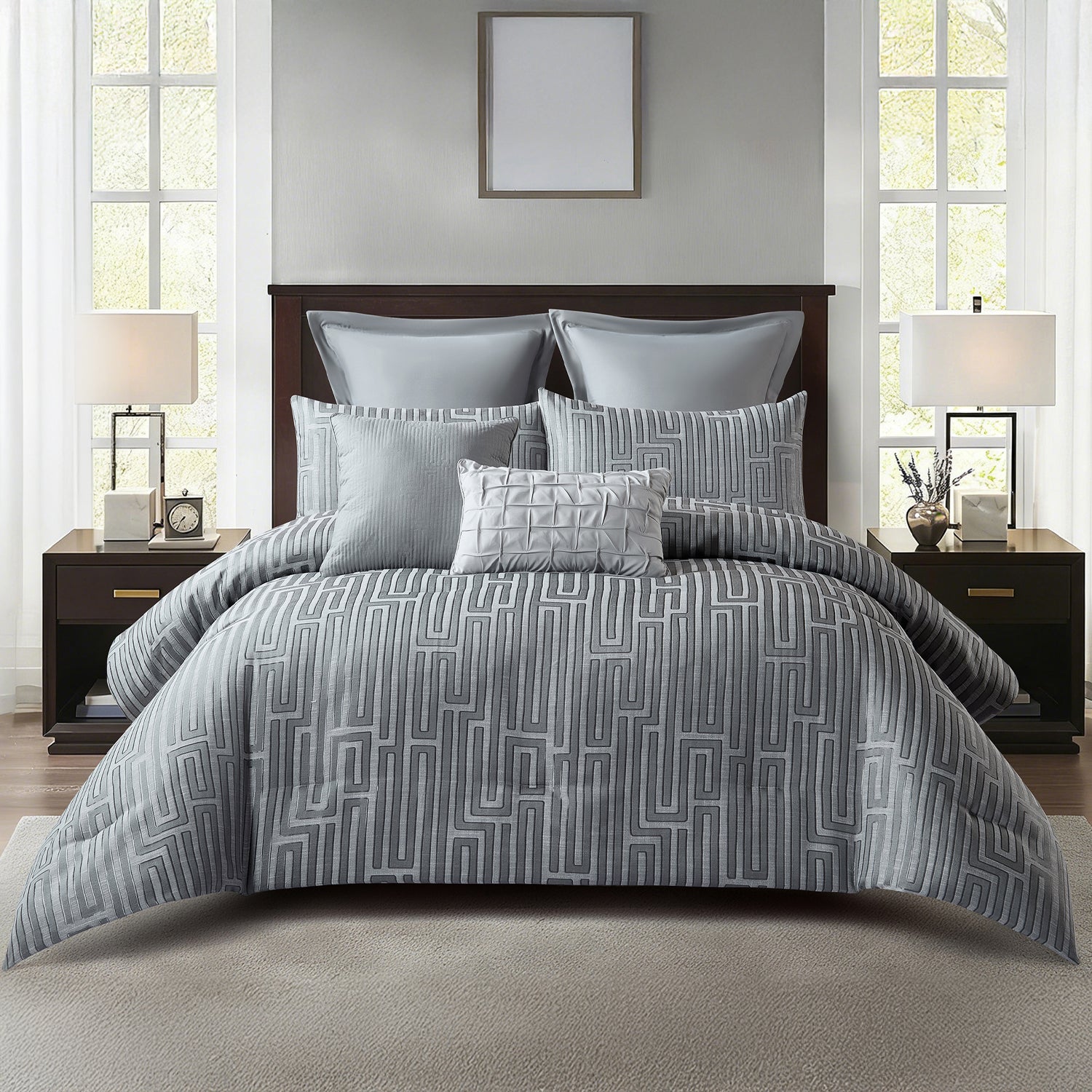 Grey ribbed comforter set styled on a bed with matching pillows in a neutral bedroom.