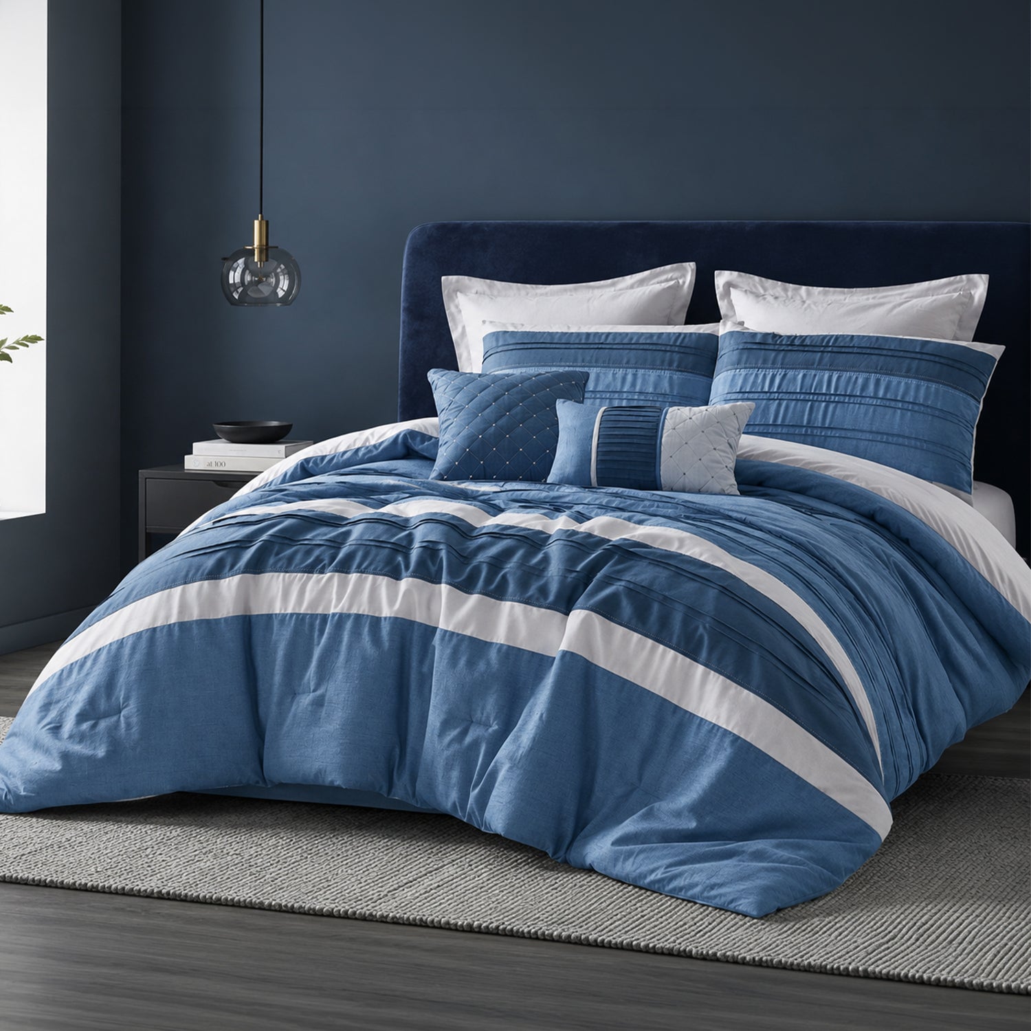 Blue striped duvet cover set styled on a bed with matching pillowcases in a dark blue bedroom.