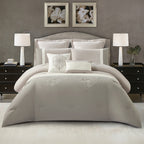 Grey comforter set styled on a bed with matching pillows in a modern bedroom.