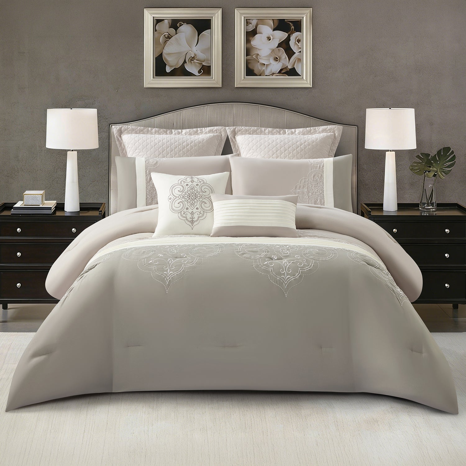 Grey comforter set styled on a bed with matching pillows in a modern bedroom.