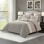 Grey comforter set styled on a bed with matching pillows in a modern bedroom.