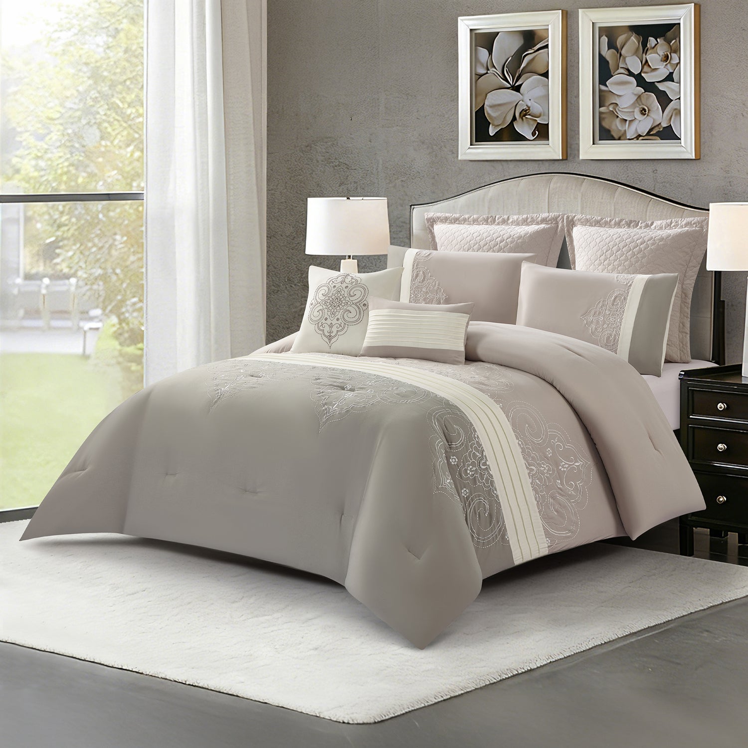 Grey comforter set styled on a bed with matching pillows in a modern bedroom.