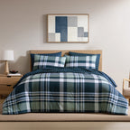 Home Co. Stanley Comforter Set featuring a bold navy, sage green and white check design, styled on a bed in a contemporary bedroom.