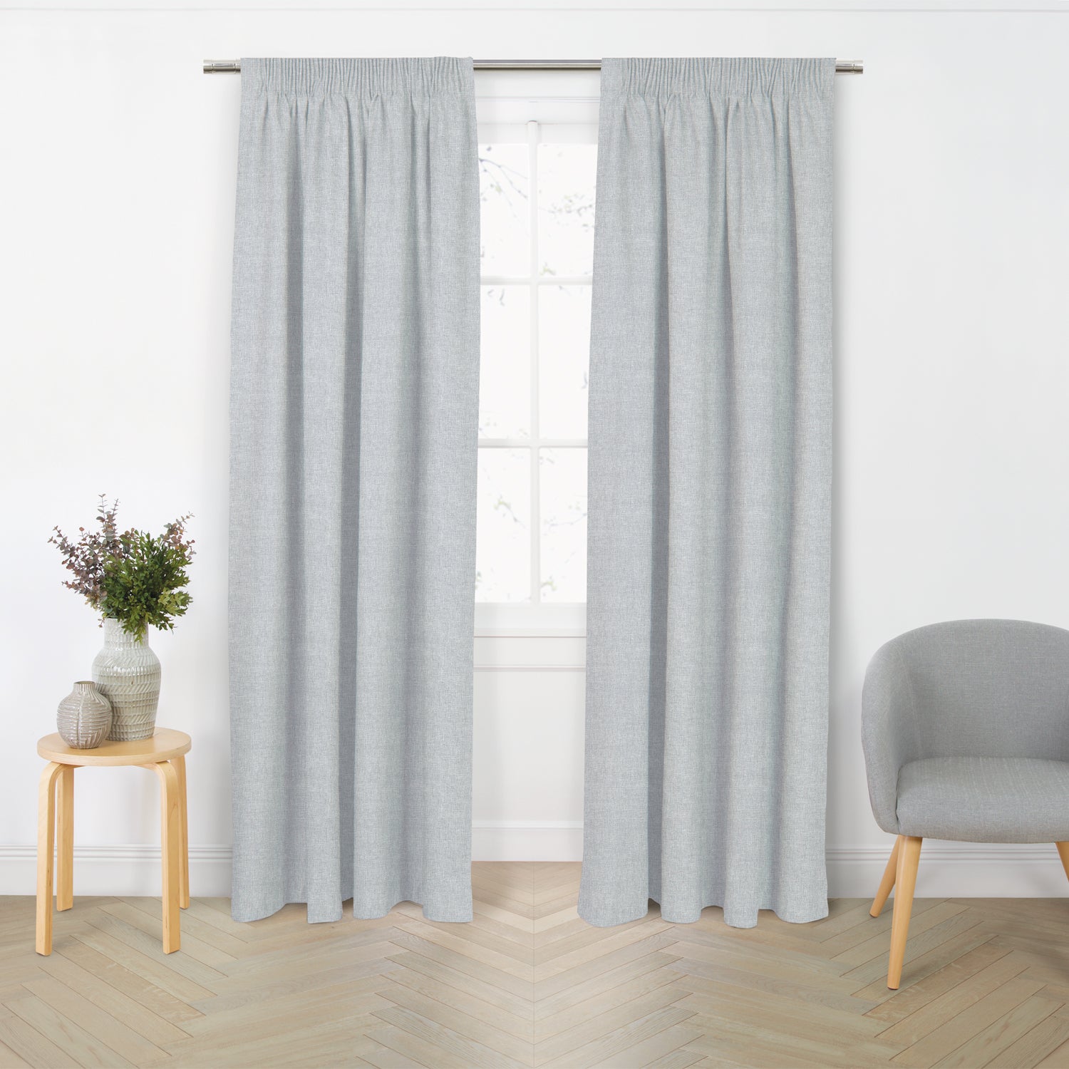 Style Co. Luma Blockout Readymade Curtain Pair in Silver Grey shown hanging in a styled room setting.