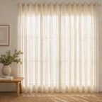Soft linen sheer eyelet curtains gently filter natural light, creating a bright, airy, and inviting living space.