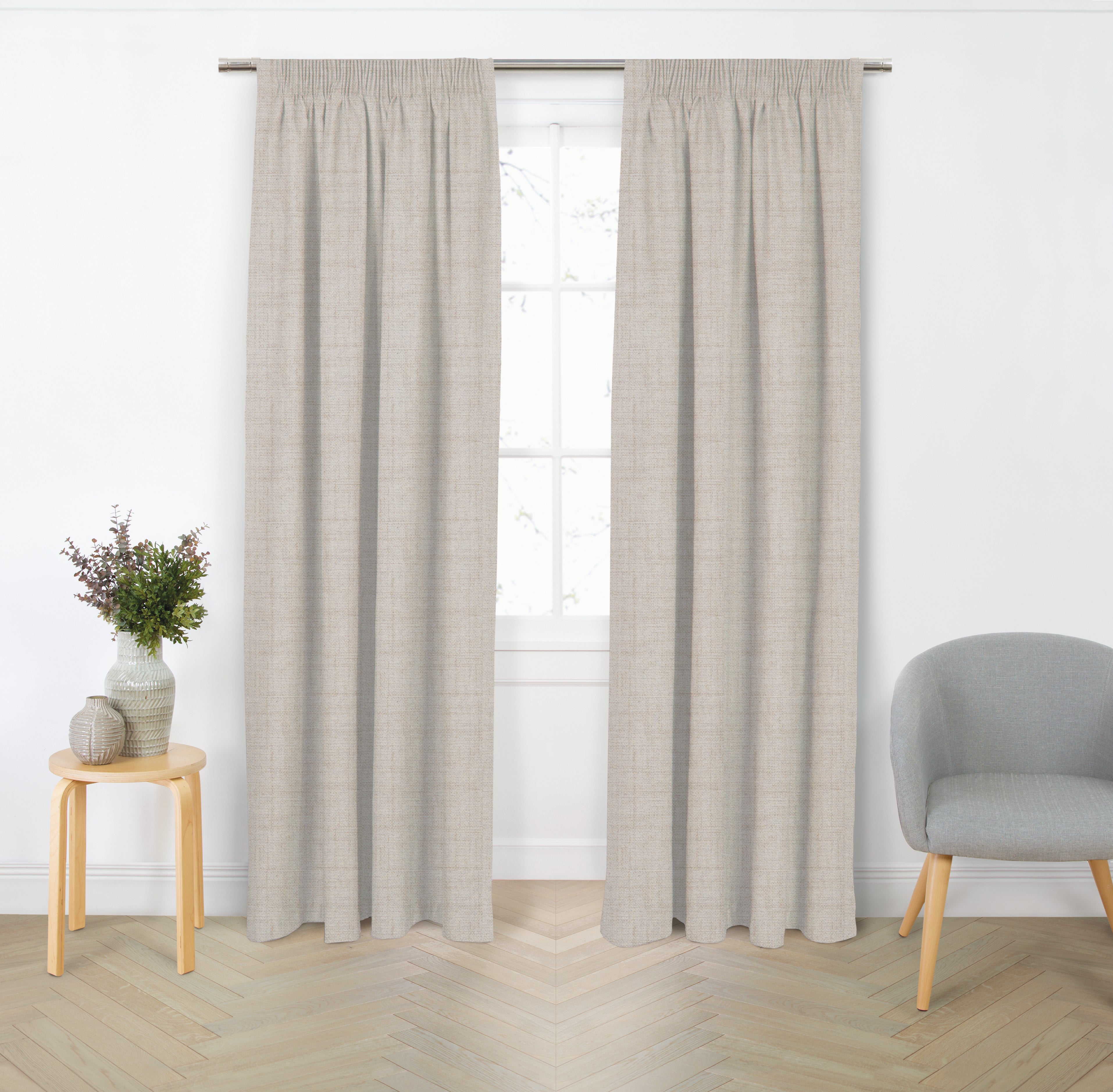 Natural blockout curtain pair with gathered header displayed in a bright modern living room.