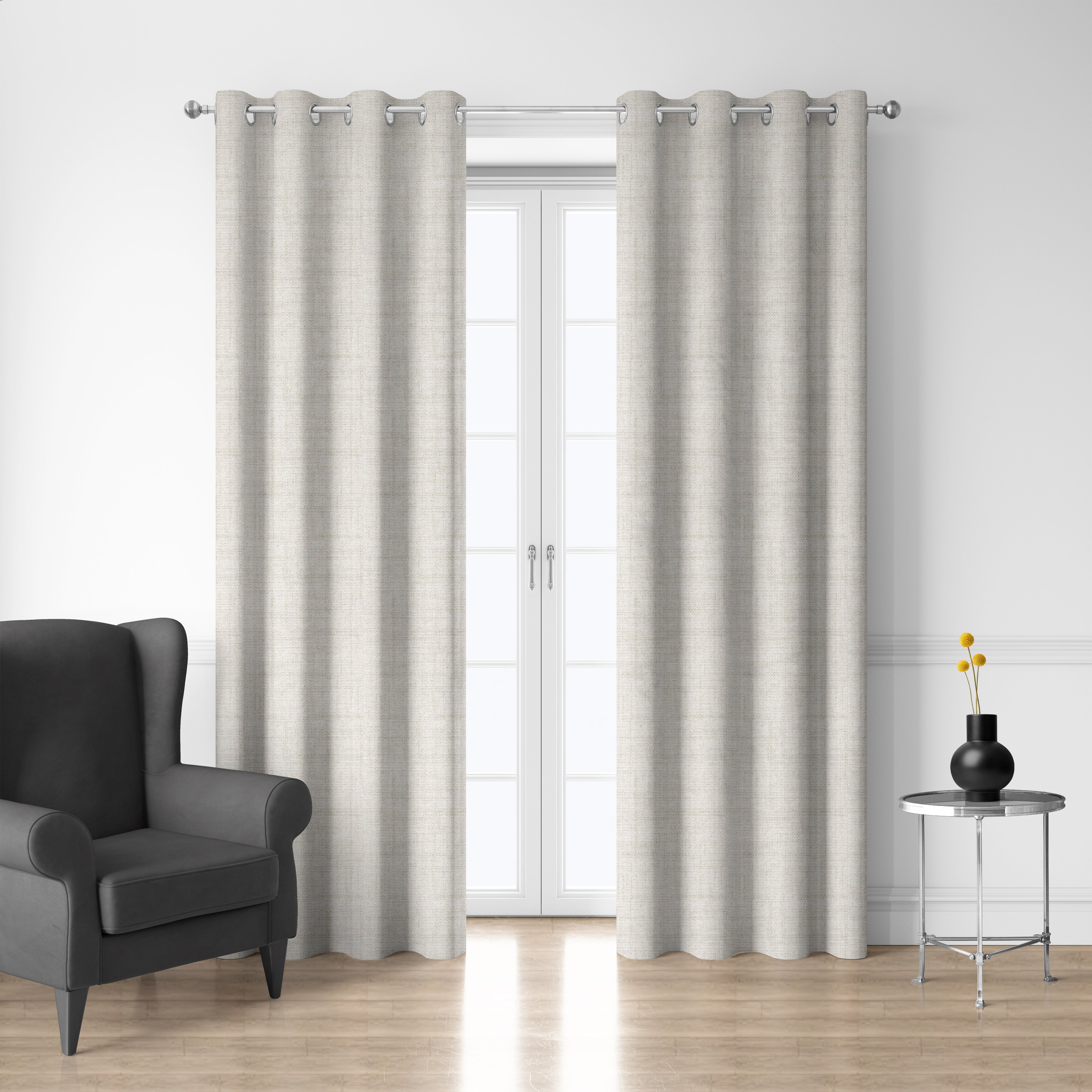 Style Co. Belmont Blockout Eyelet Curtain Pair in natural displayed over glass doors in a modern living room with silver eyelets.