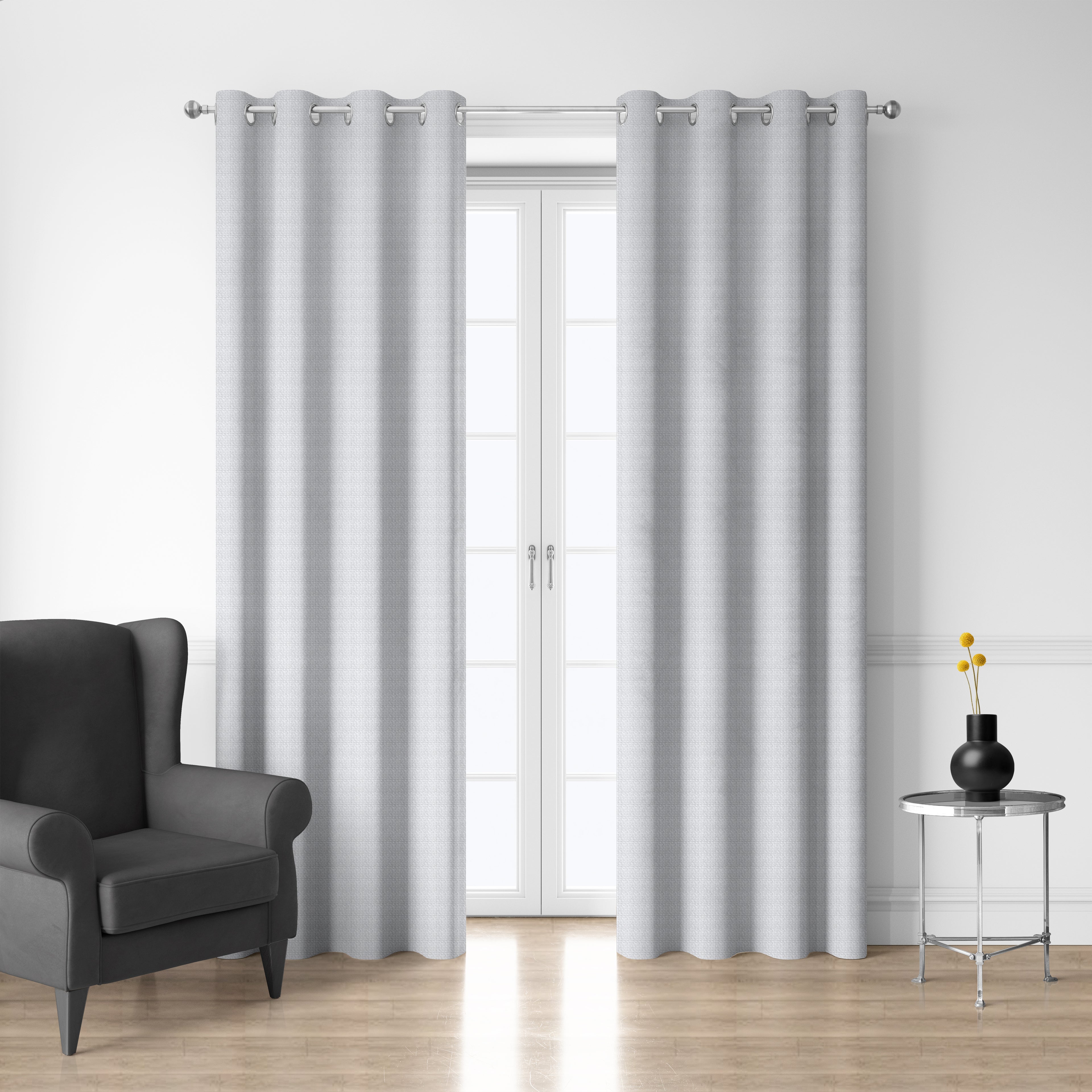 Style Co. Belmont Blockout Eyelet Curtain Pair in whisper white displayed over glass doors in a modern living room with silver eyelets.