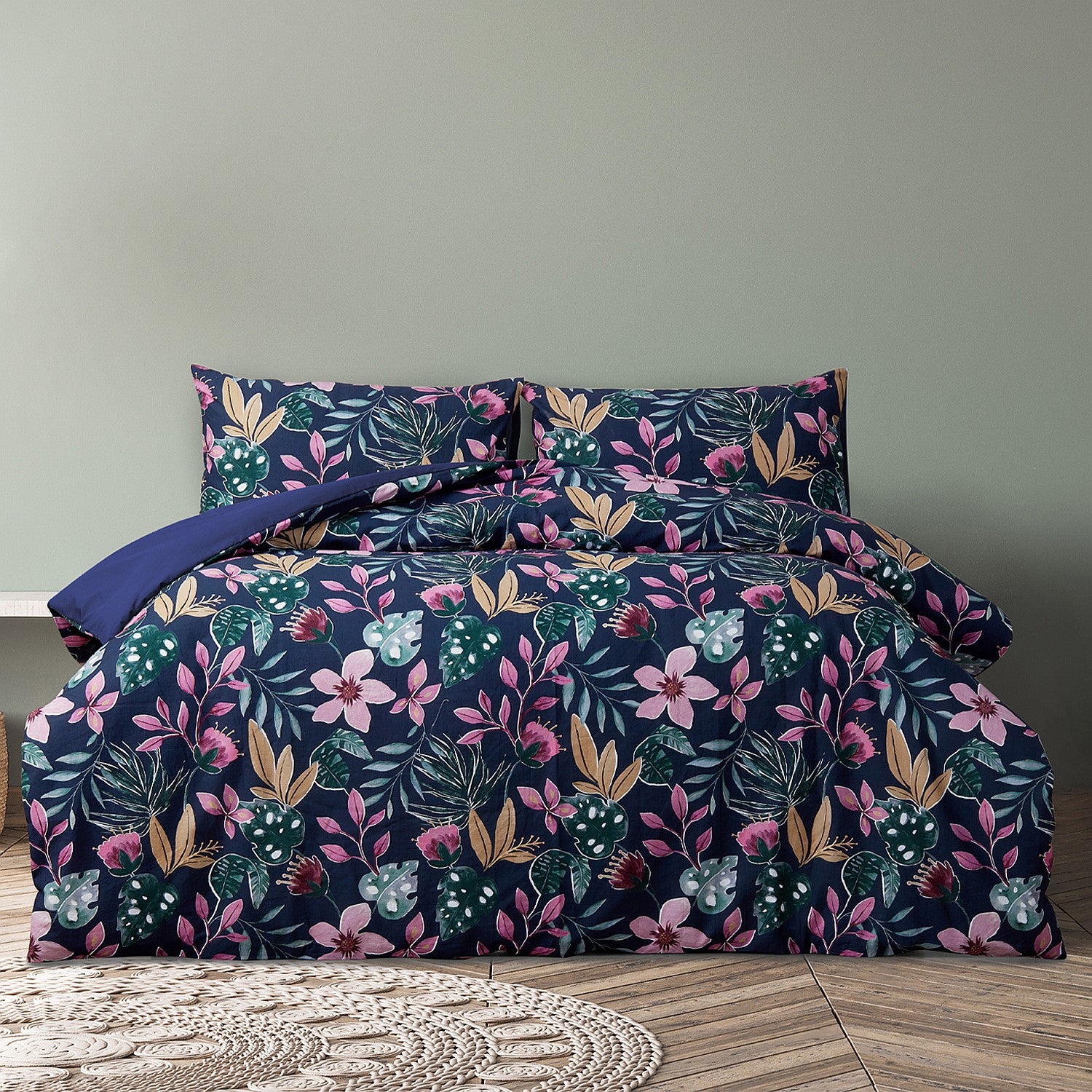 Floral bedding set on a bed with a neutral background