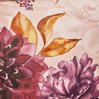 Close-up of floral and leaf design on fabric with pink and purple flowers.