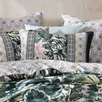 Patterned bedding set with tropical leaf designs on a neutral background