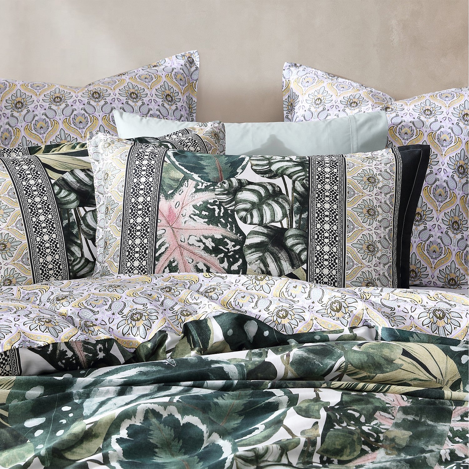 Patterned bedding set with tropical leaf designs on a neutral background