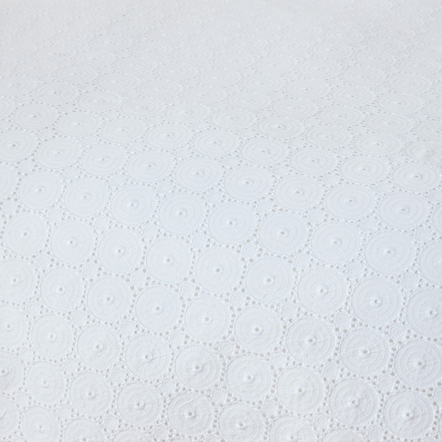 White fabric texture with a subtle pattern