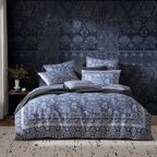Bedroom with floral-patterned bedding and wall decor