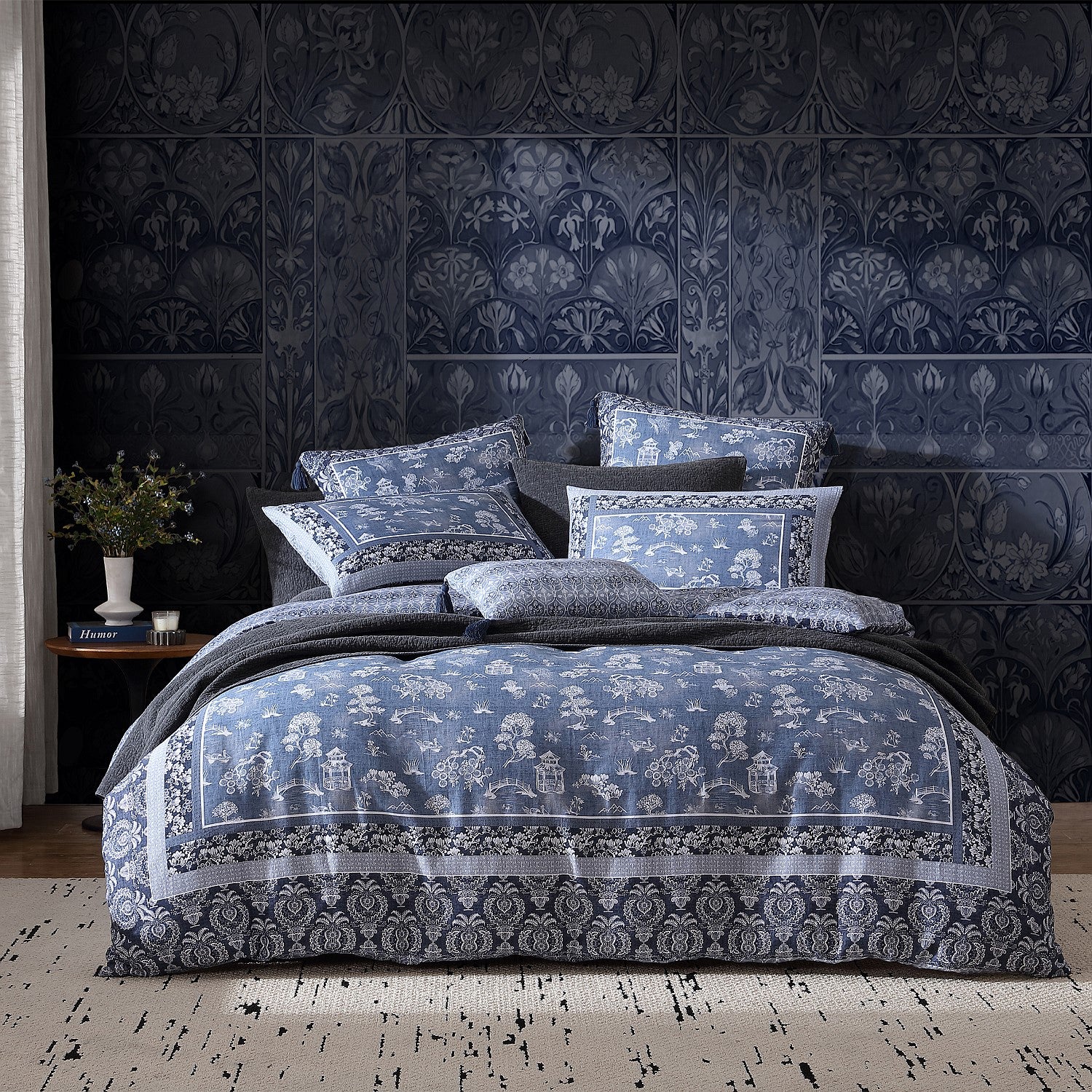 Bedroom with floral-patterned bedding and wall decor
