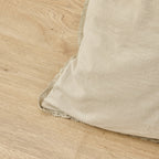 Beige rug corner on a wooden floor
