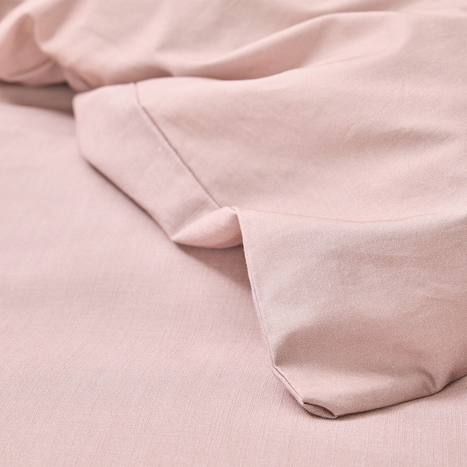 Close-up of soft pink fabric with a subtle texture