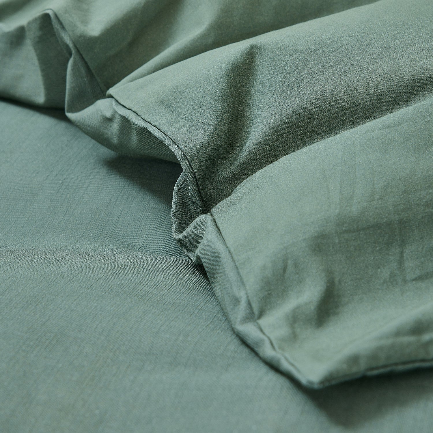 Close-up of green fabric with a textured surface