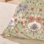 Floral-patterned pillow on a textured surface