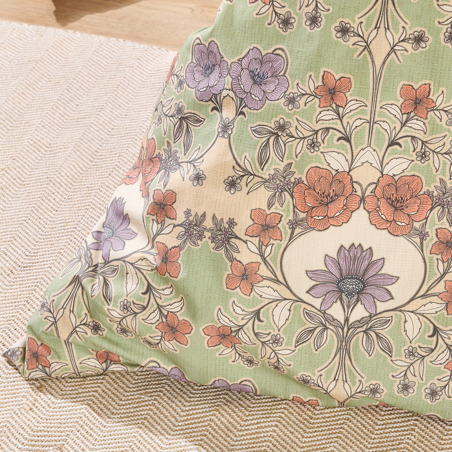 Floral-patterned pillow on a textured surface