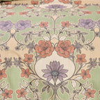 Floral patterned fabric with a central design on a beige background