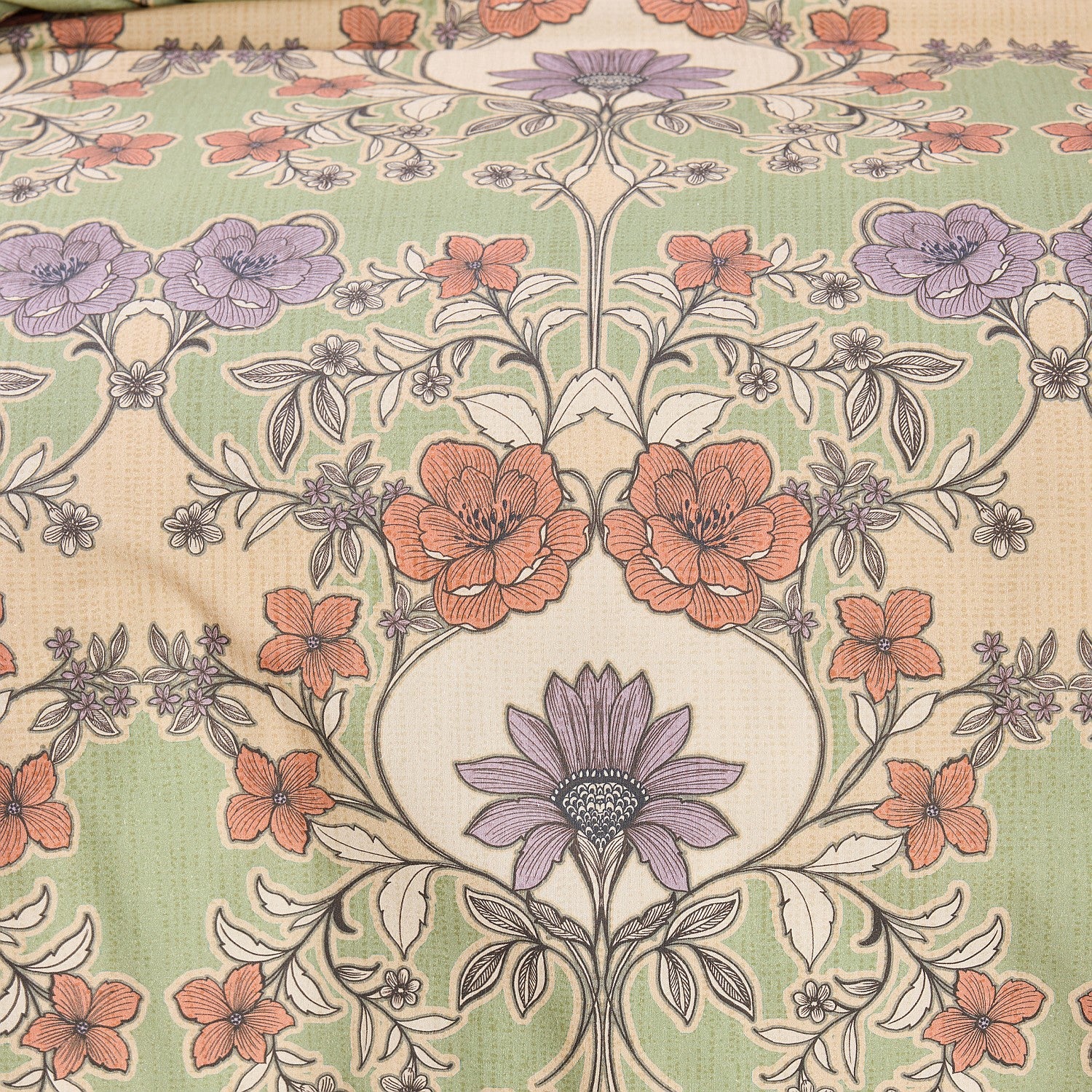 Floral patterned fabric with a central design on a beige background