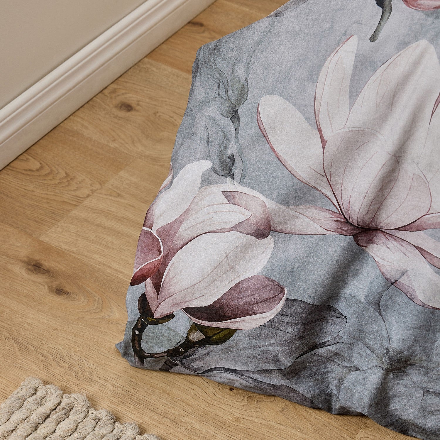Floral-patterned rug on a wooden floor