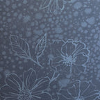 Floral pattern with blue flowers on a textured blue background