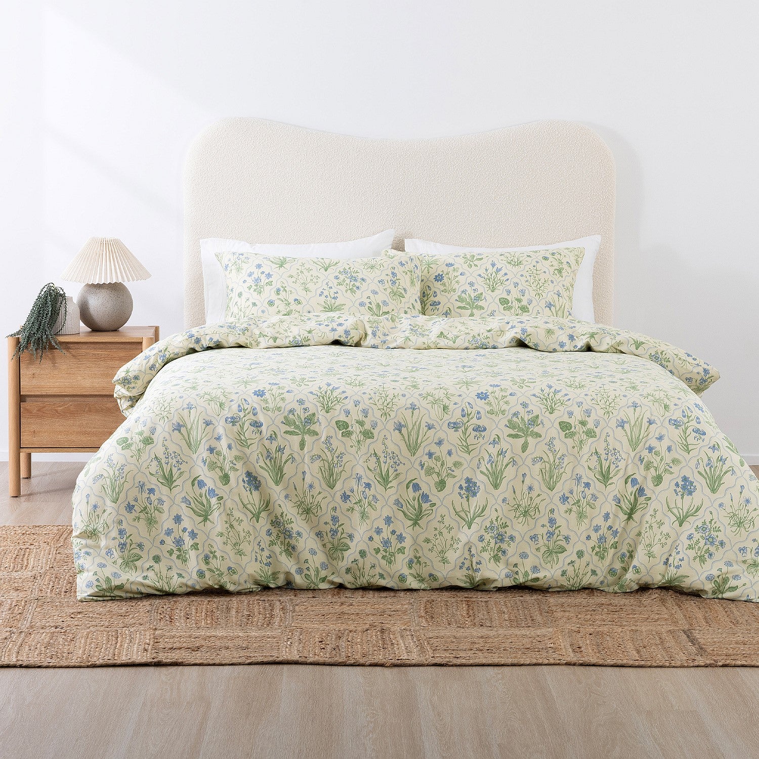 Bed with floral bedding in a bedroom setting