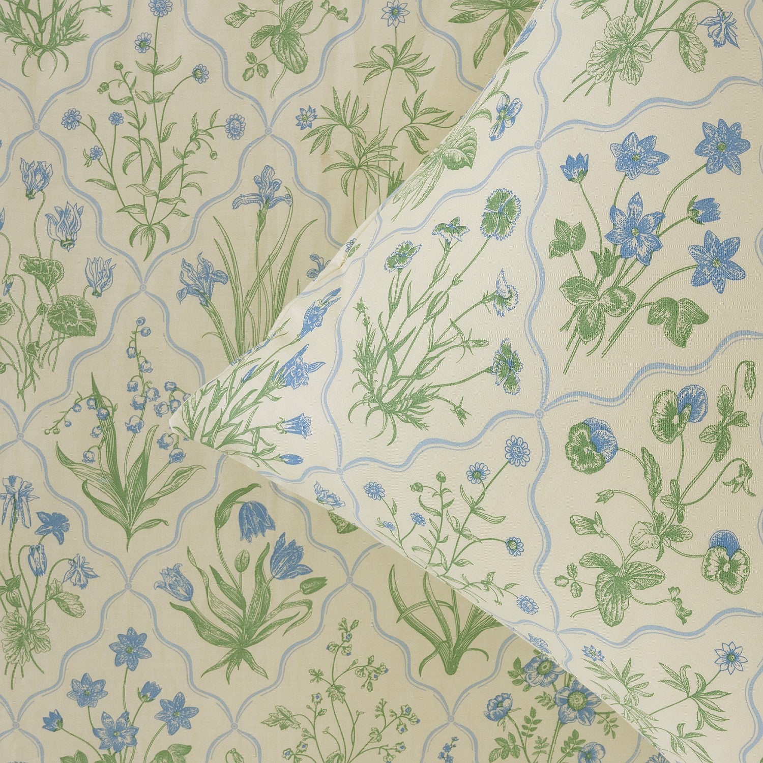 Floral patterned fabric with blue and green flowers on a beige background