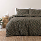 Floral patterned duvet cover set on a bed in a bedroom setting.