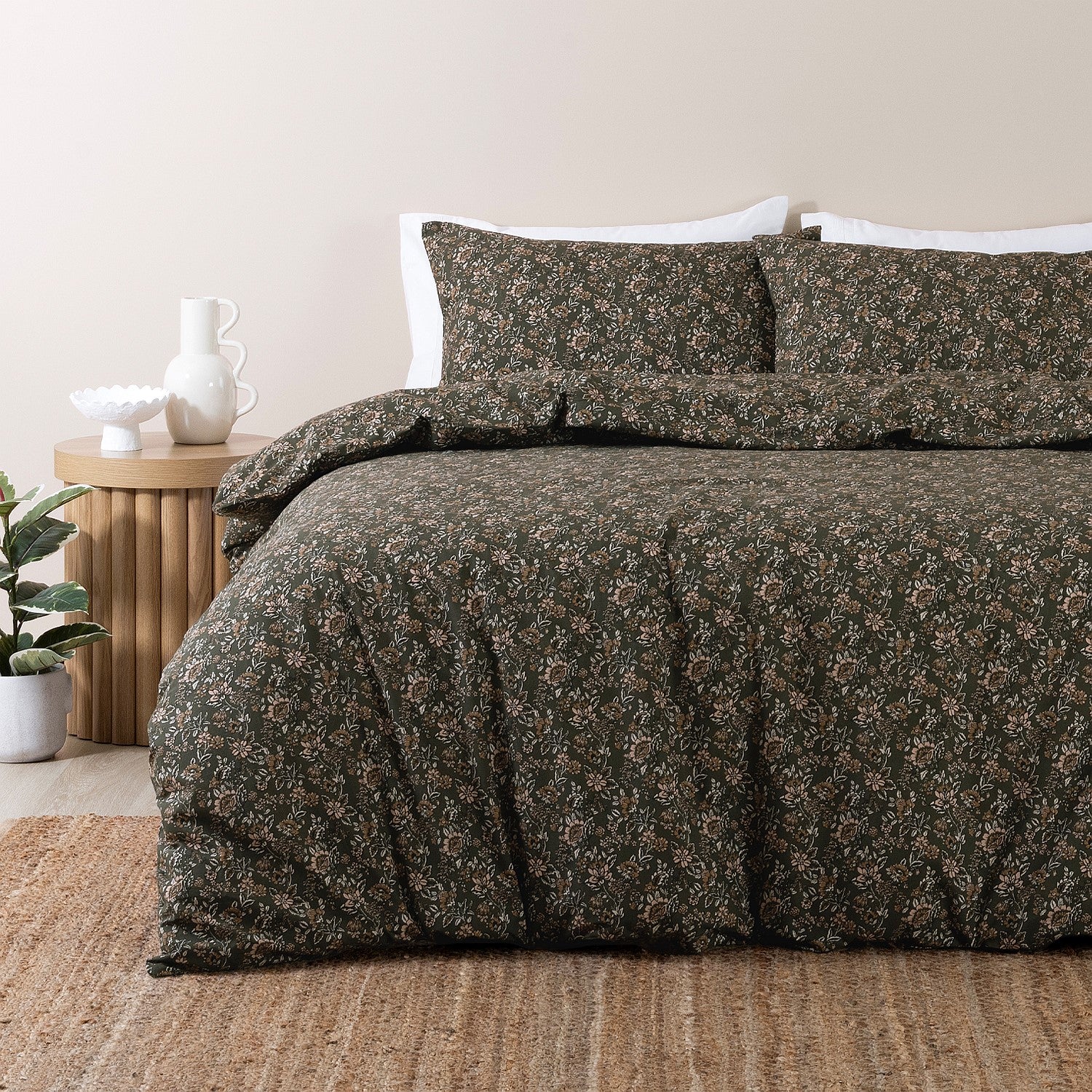 Floral patterned duvet cover set on a bed in a bedroom setting.