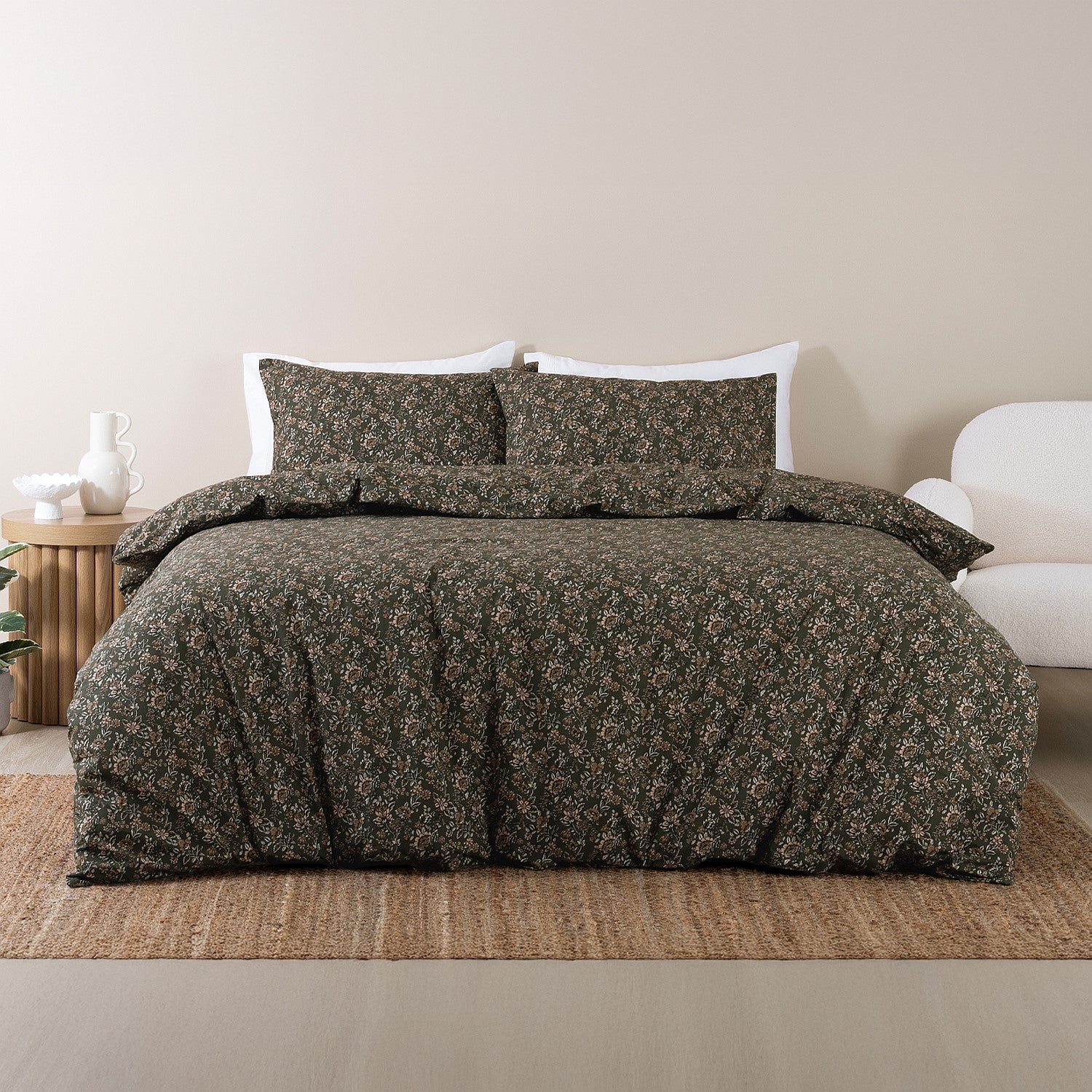 Floral patterned duvet cover set on a bed in a bedroom setting.
