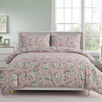 Floral bedding set on a bed in a bedroom with a window in the background.