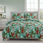Tropical floral bedding set on a bed with a dresser and window in the background.