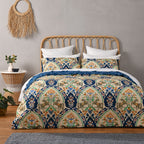 Bed with patterned bedding in a bedroom setting