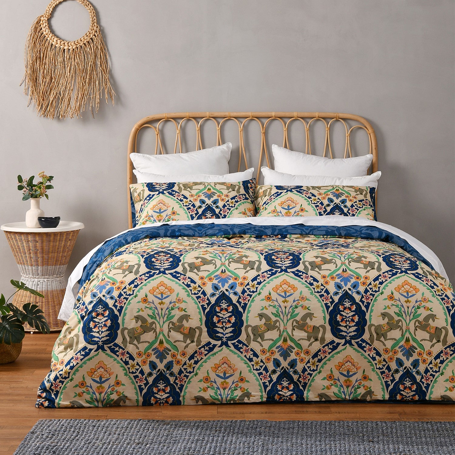 Bed with patterned bedding in a bedroom setting