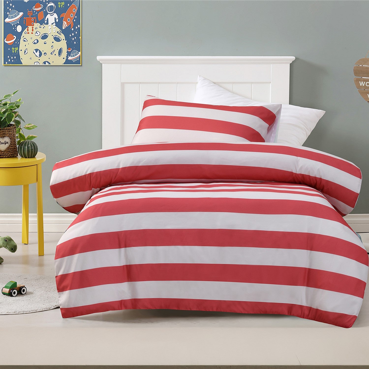 Red striped duvet cover set styled on a bed with matching pillowcases in a kids bedroom.