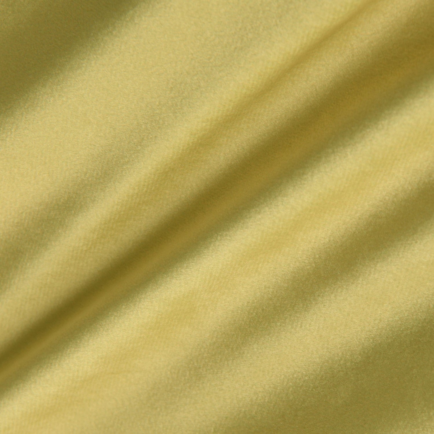 Close-up of a yellow fabric with folds