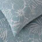 Textured fabric with floral pattern in blue and gray tones