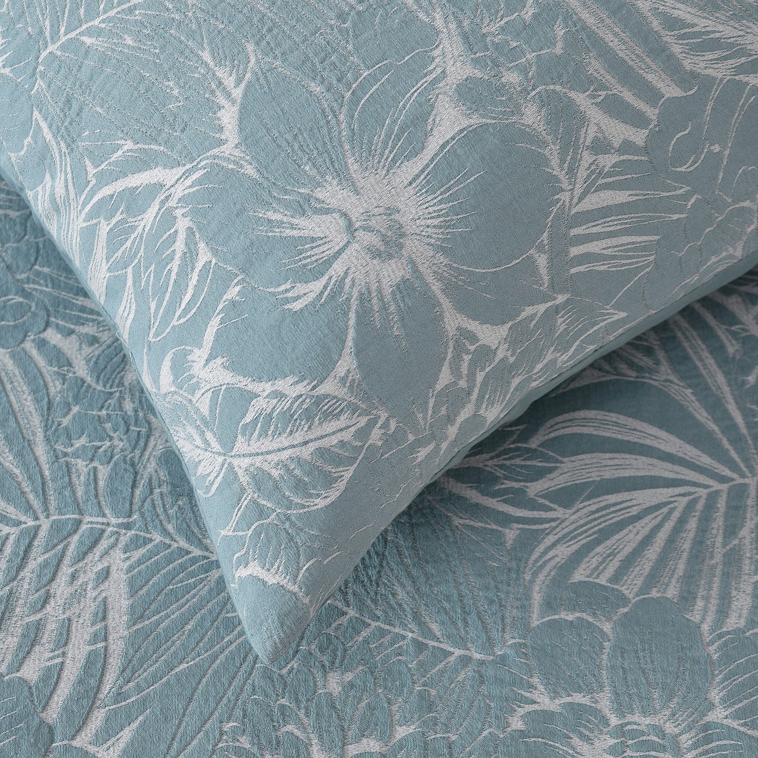 Textured fabric with floral pattern in blue and gray tones