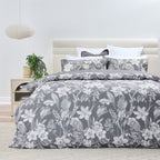 Bed with floral patterned bedding in a bedroom setting
