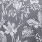 Botanical pattern of flowers and leaves on a dark gray background