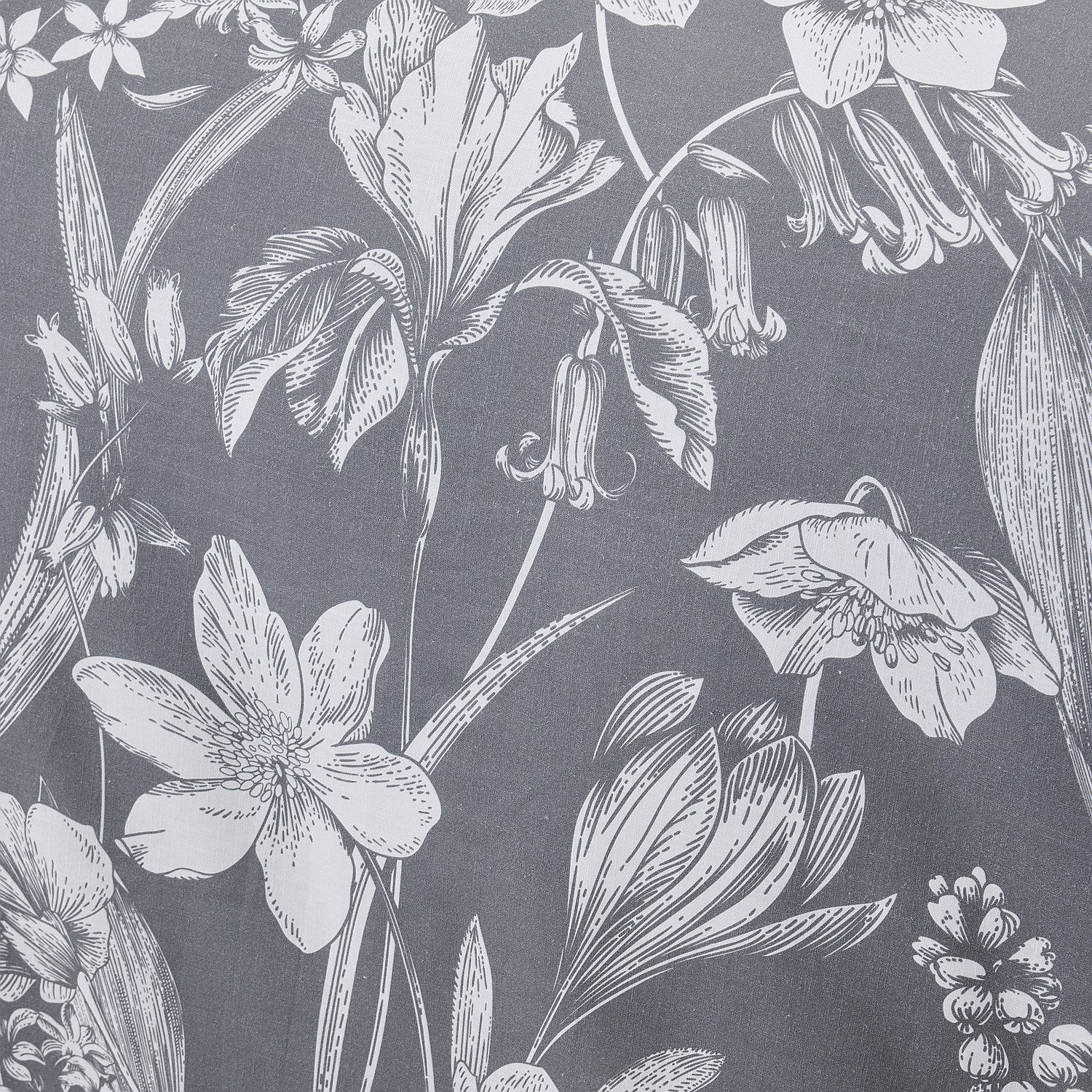 Botanical pattern of flowers and leaves on a dark gray background
